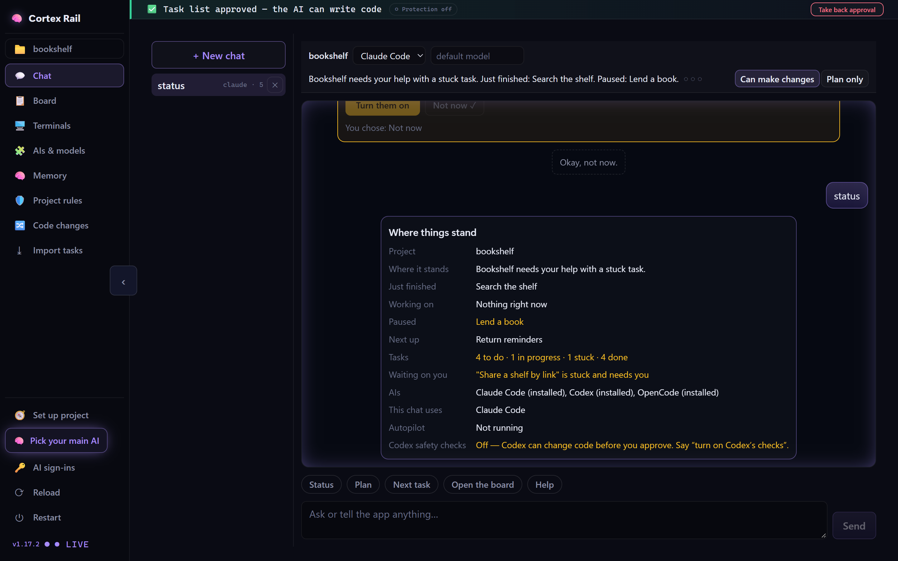 The chat in the real app answering 'status' with a plain summary of the project